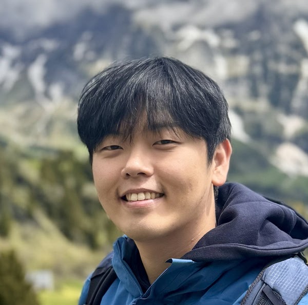 Hyunwoo Ryu outdoors in the mountains
